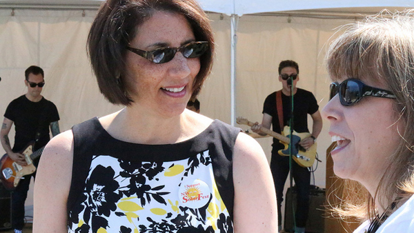 Incoming Shoreline Community College President Cheryl Roberts( left) and recently appointed Shoreline School District Superintendent Rebecca Miner share a moment at SolarFest, July 26, 2014, on campus