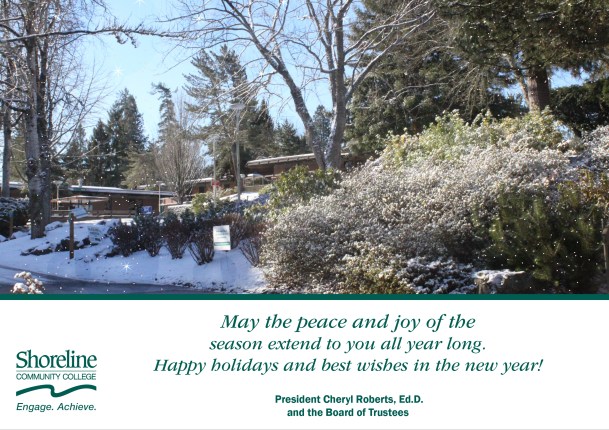 A photo of trees in the campus courtyard covered in snow. Beneath the photo, text reads: "May the peace and joy of the season extend to you all year long. Happy holidays and best wishes in the new year!" Signed, President Cheryl Roberts, Ed.D. and the Board of Trustees