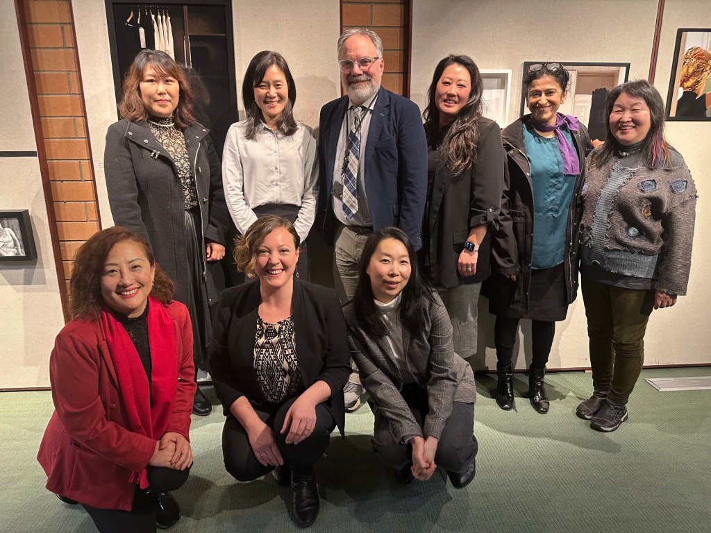 This is an image of the people mentioned above in the text standing in our art gallery