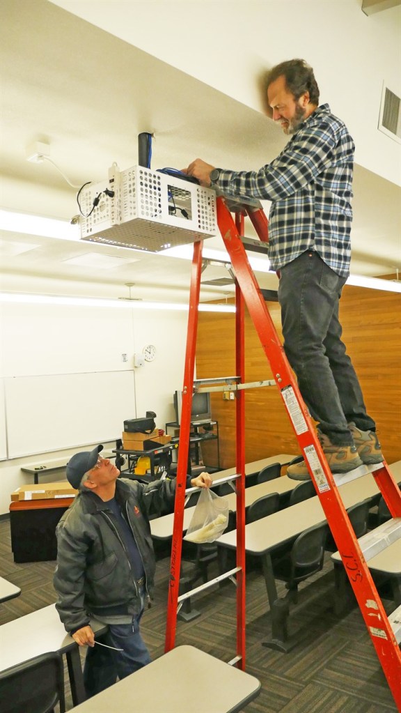 Paul and Dave work on projector