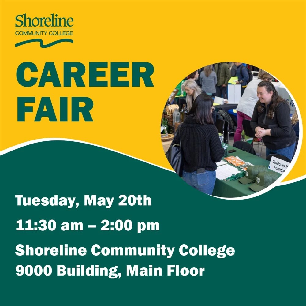 People visiting tables at a career fair. 