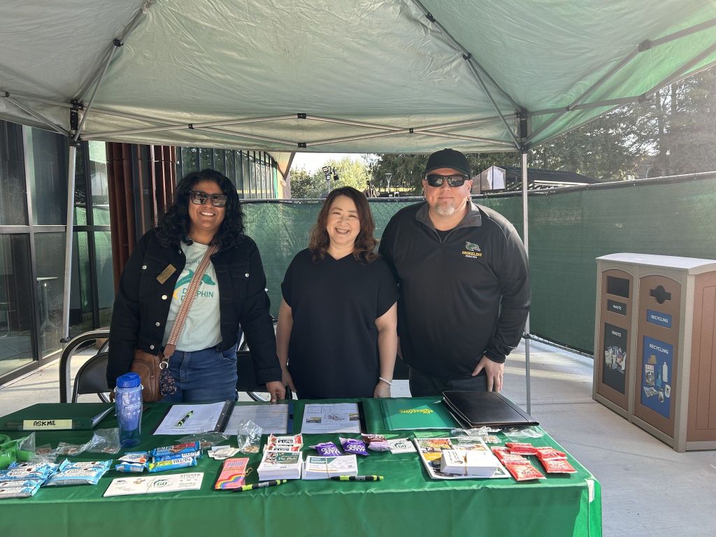 Staff at a welcome table.