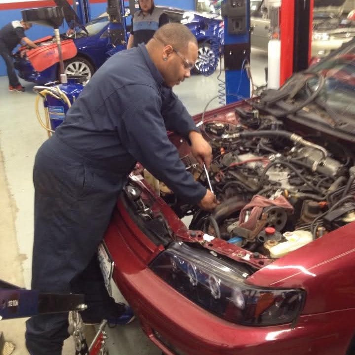 Rashawn working on his '95 Honda Accord. 