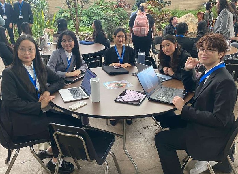 5 students seated at a table