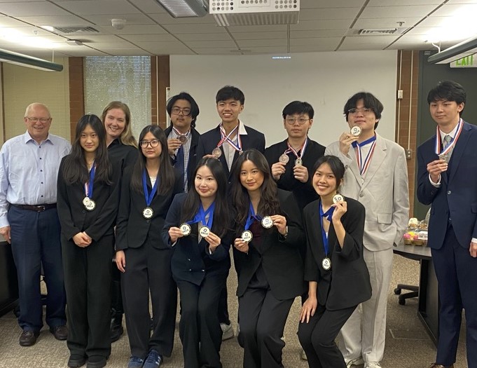 a group of students wearing medals