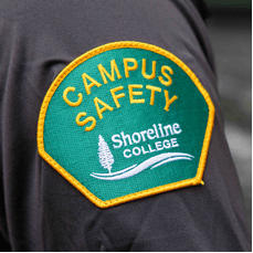 Green patch that says "Campus Safety"  in yellow. 