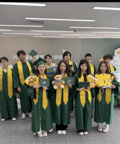 A group of Chinese student gather for a pre-graduation celebration