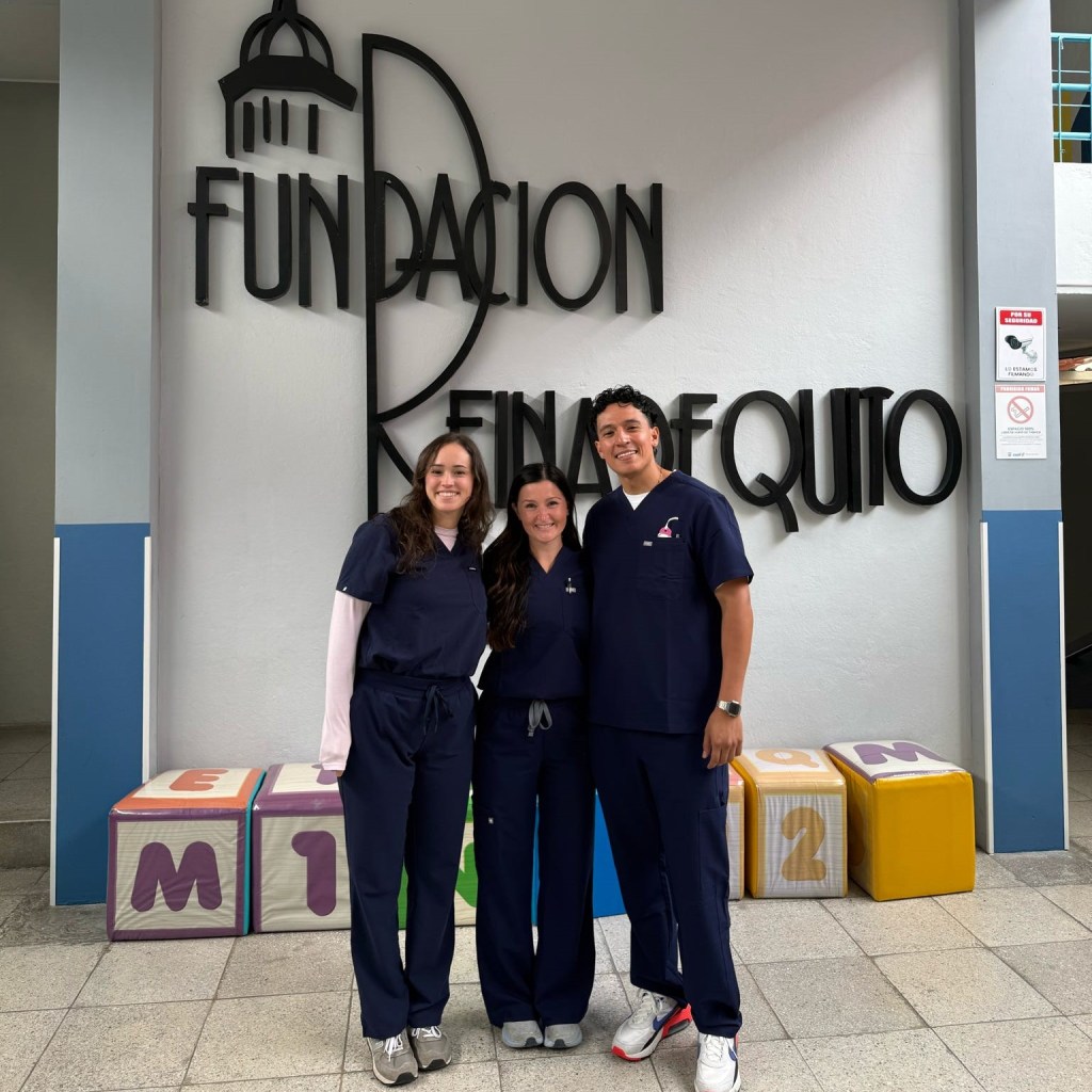Indoor photo of three nursing students.