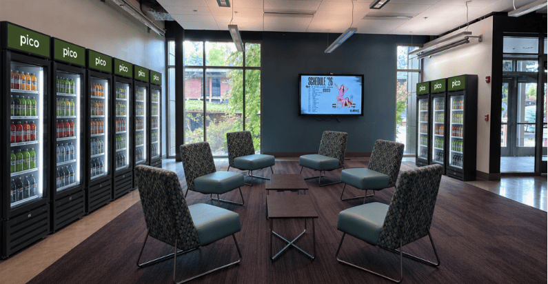 Generative AI picture showing proposed placement of up to 9 Avanti Market PICO 360 Coolers along the two walls in the seating area of Maple Student Union, Building 9000.