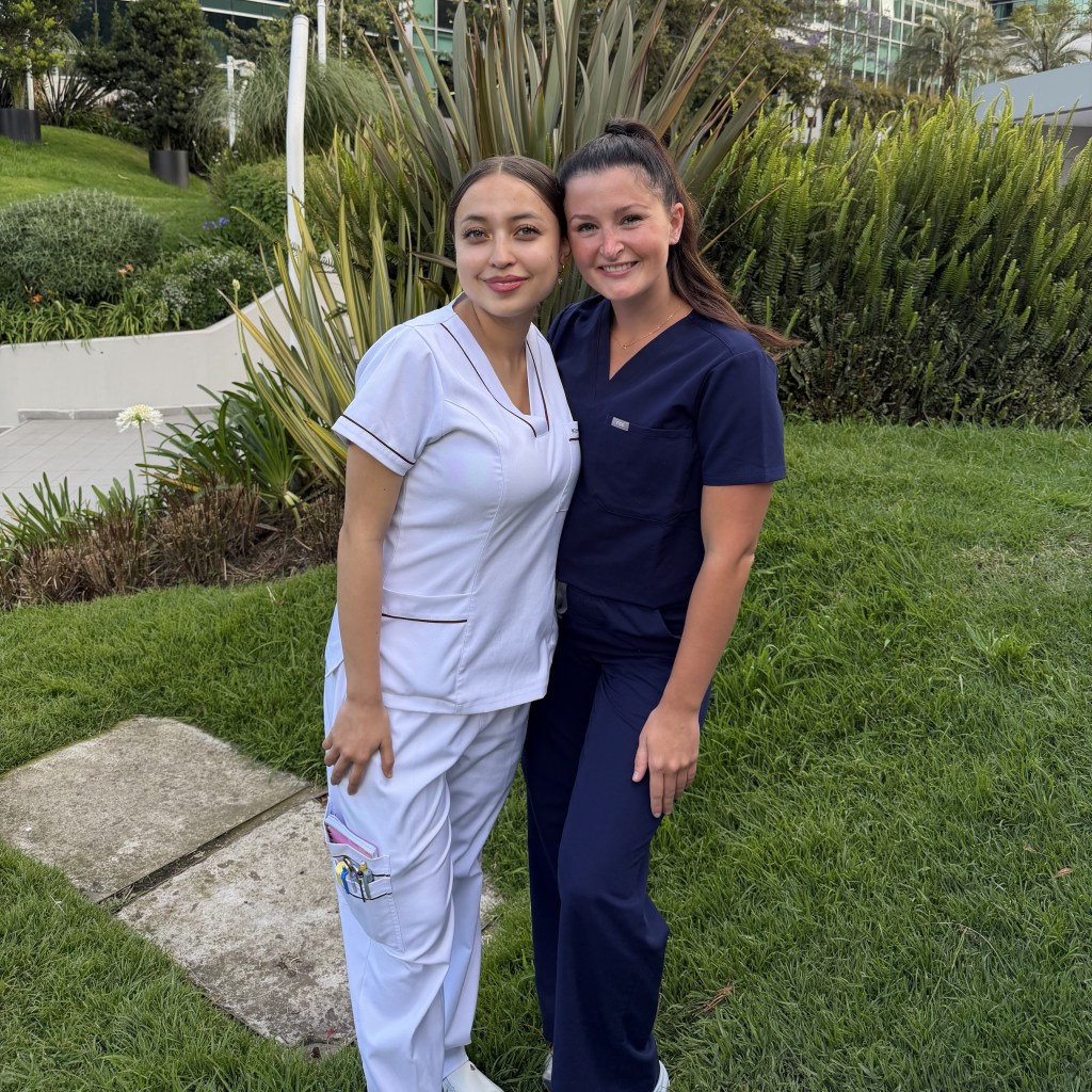 Two nursing students posing outdoors.